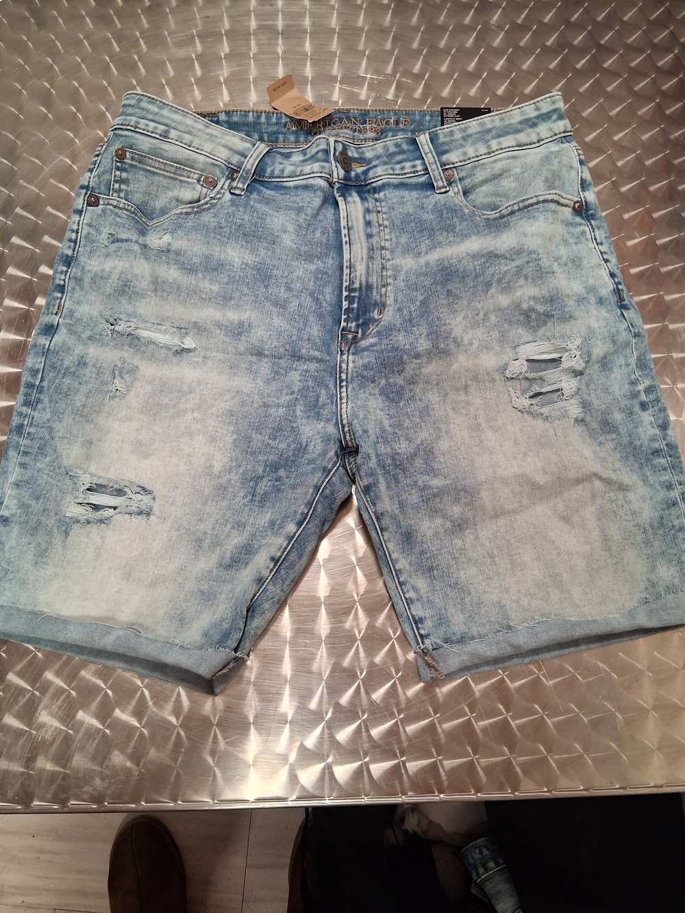 American Eagle Outfitters light blue distressed denim shorts